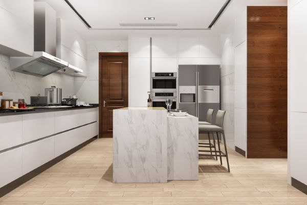 muebles de cocina con granito; una vista amplia de una cocina con barra y muebles de granito de color blanco